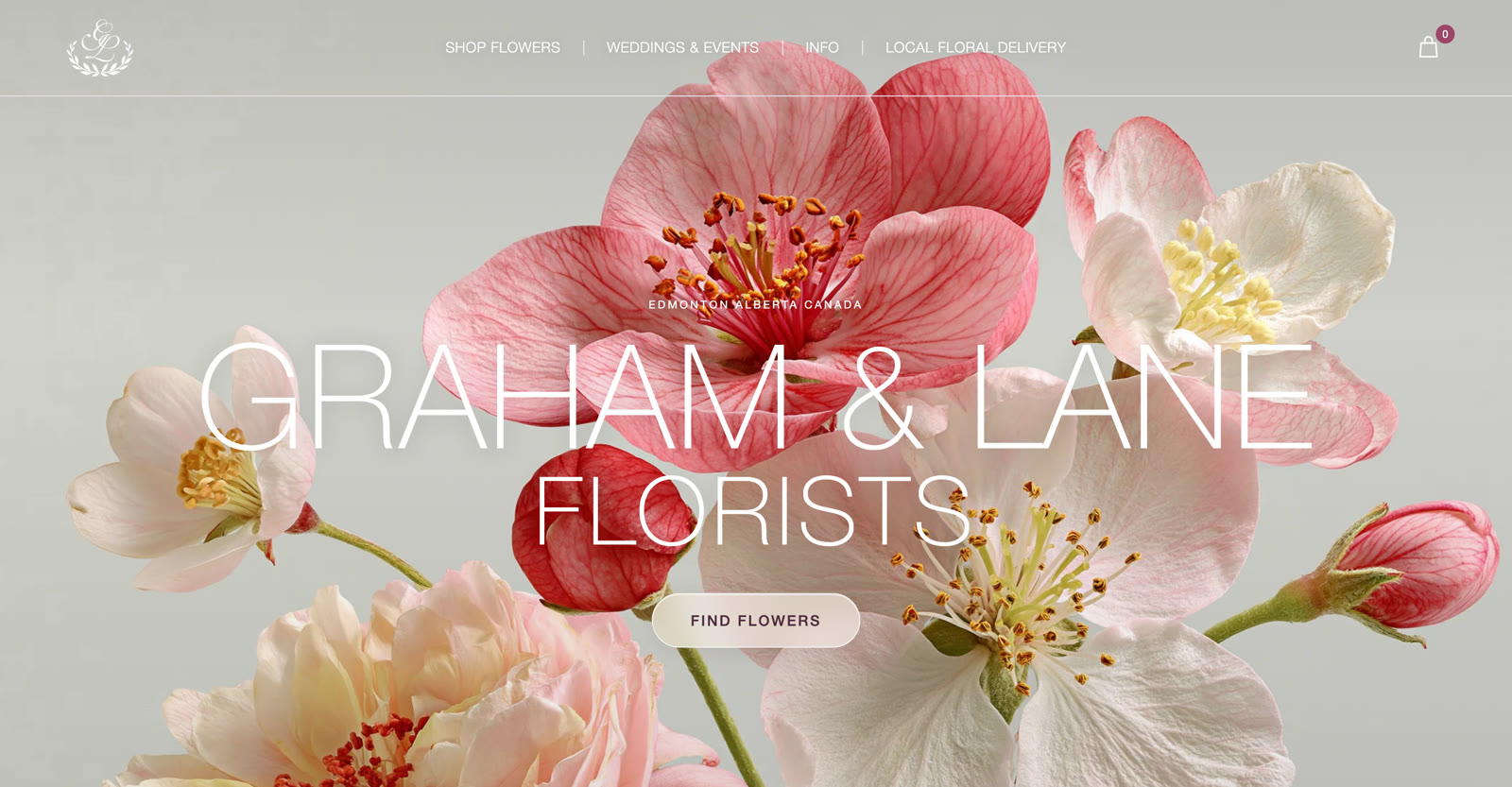 The Graham & Lane Florists homepage with large pink and white blossoms